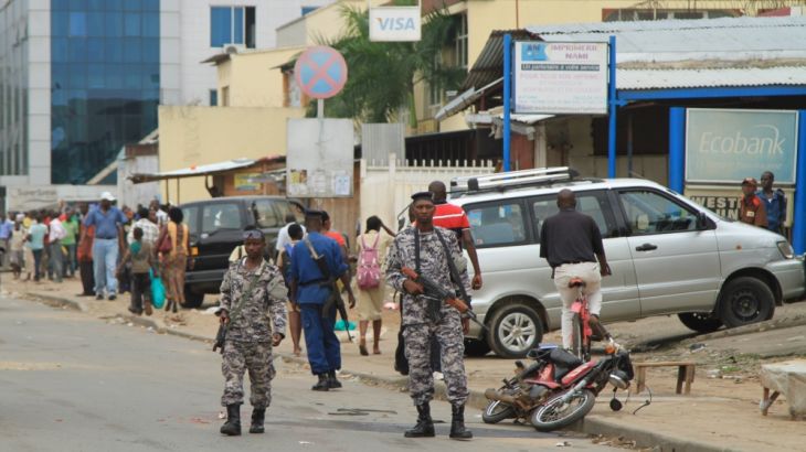 Policemen and soldiers patrol the streets after a grenade attack of Burundi''s capital Bujumbura