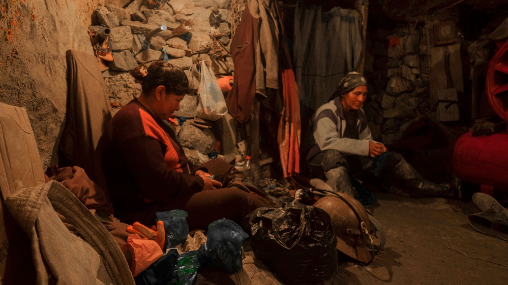 The women take a break from work in a cave inside the mine [Eline van Nes/Al Jazeera]