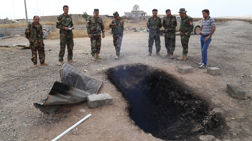 Fearing the presence of explosives or suicide bombers, the Peshmerga forces did not want to take the risk of entering the ISIL tunnel [Mohammed Salih/Al Jazeera]