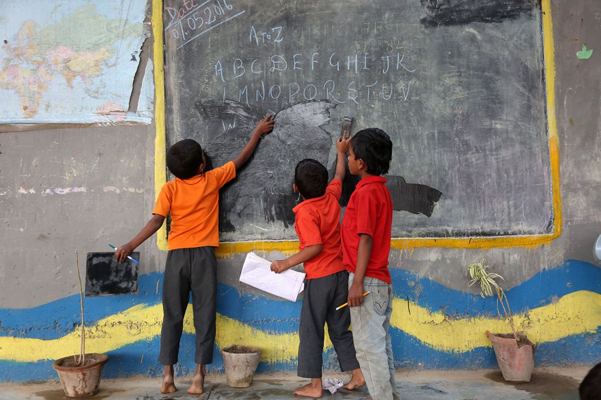 Free school under bridge for poor and needy children [Showkat Shafi/Al Jazeera]