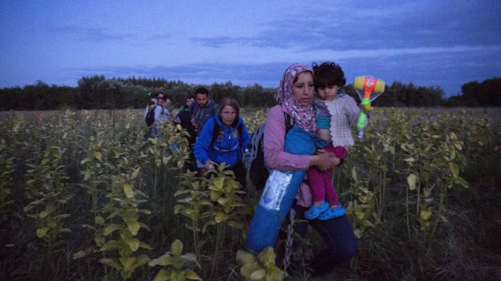 Refugees are smuggled through fields and forests in an attempt to evade the Hungarian police