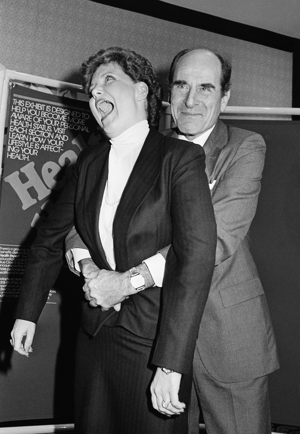 A 1985 photo of Dr Henry Heimlich demonstrating how the Heimlich Manoeuvre is used on a patient [AP]