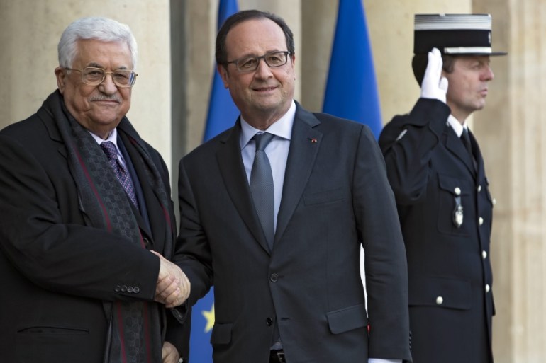French President Francois Hollande greets Palestinian National Authority President Mahmoud Abbas as he arrives for a meeting at the Elysee Palace in Paris, France [EPA]
