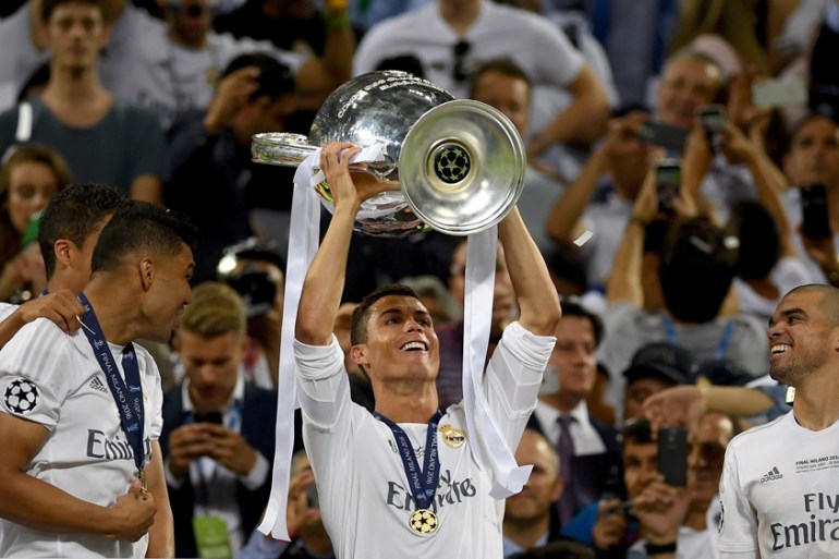 Cristiano Ronaldo of Real Madrid lifts the Champions League trophy