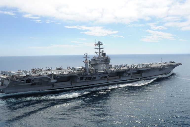 USS Abraham Lincoln passes through the Strait of Hormuz