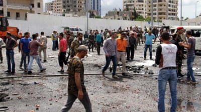 The bombing site at a bus station in the coastal city of Tartus, Syria [EPA]