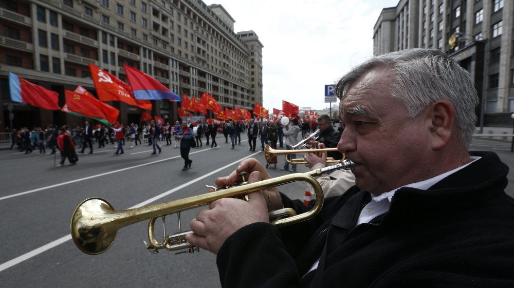  Tens of thousands marched across Moscow's Red Square on Sunday morning in a pro-Kremlin workers' rally [Reuters]