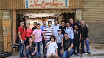 A team of volunteers are helping to renovate Stars Cinema [Mohamed Barbar/Al Jazeera]
