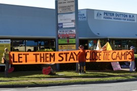 Refugee activists protest outside the electoral office of Australian Immigration Minister Peter Dutton in Brisbane