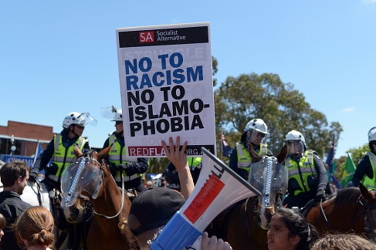 Members of the Campaign Against Racism and Fascism hold a rally in Melbourne, Australia in 2015 [Getty]