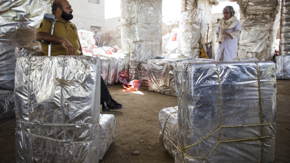 Tables and chairs made of plastic wrappers within a thermopore shell [Faras Ghani/Al Jazeera]
