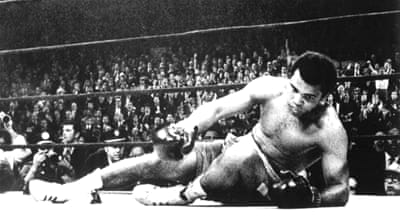 US boxer Muhammad Ali lying on the ground during the 15th round of his bout against Joe Frazier in New York, March 1971 [EPA]