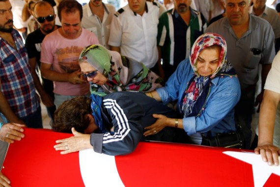 Relatives of a victim of Tuesday''s attack on Ataturk airport mourn at her flag-draped coffin during her funeral ceremony in Istanbul