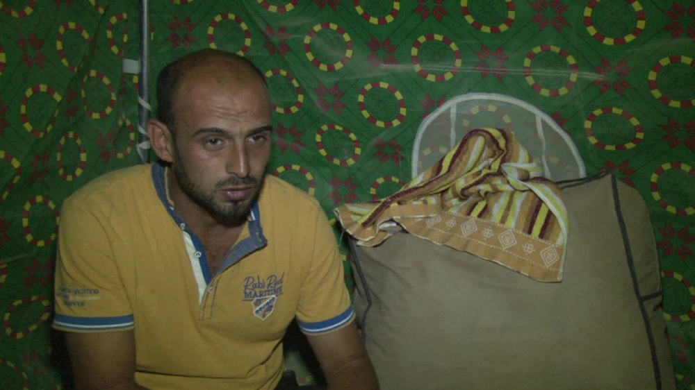 For six days, Thamer Hassoun al-Shoukor’s hands were tied behind his back from the elbow, and his legs tied together from the ankles [Salam Khoder/Al Jazeera]