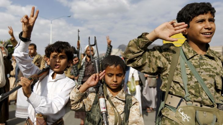 Armed boys join Houthi followers as they demonstrate against the Saudi-led air strikes in Yemen''s capital Sanaa