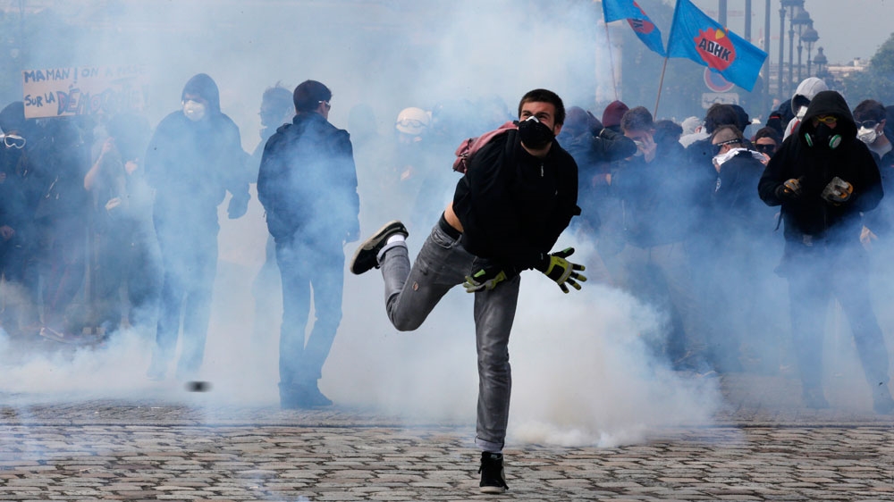 Hundreds of masked protesters hurled objects at police and stormed a building site in the capital [Reuters]