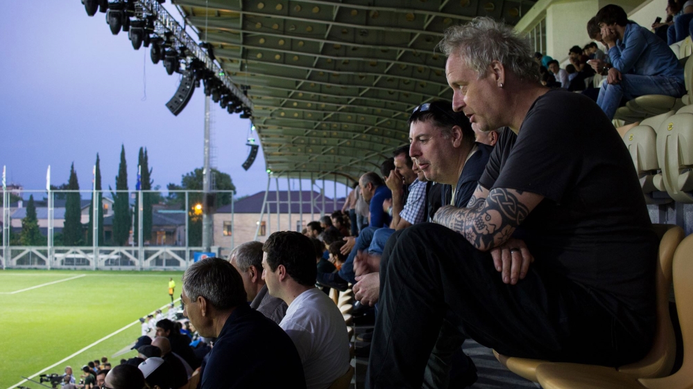 Martyn Jones and Kevin O'Donovan watching the Chagos v Western Armenia game [Nathaniel White/ Al Jazeera] 