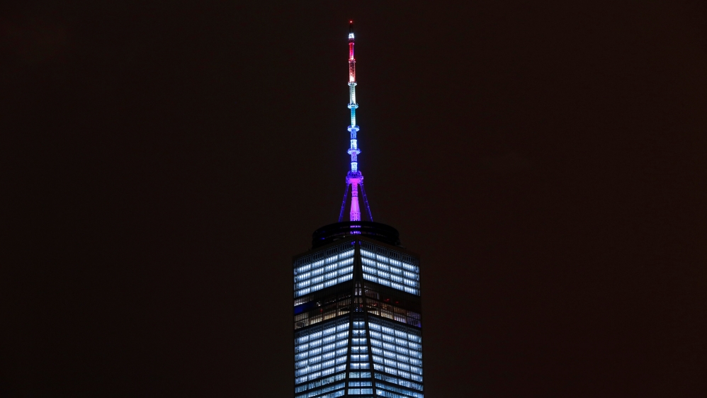 The spire of One World Trade Center is lit in rainbow colours to honour the shooting victims [Reuters/Andrew Kelly]