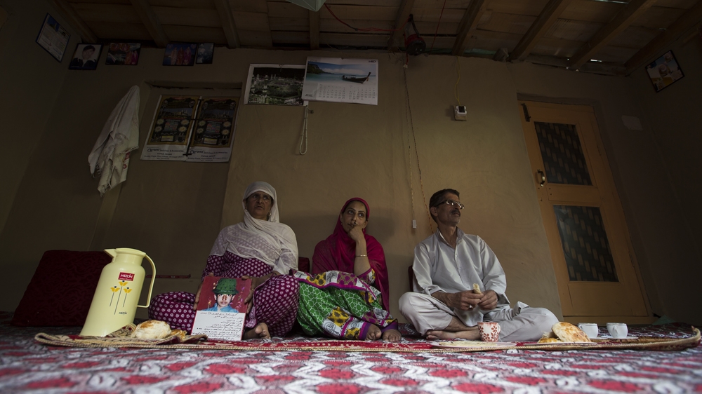 Hafiza, left, with her daughter, Shafiqa, and her husband, Ghulam [Baba Tamim/Al Jazeera]