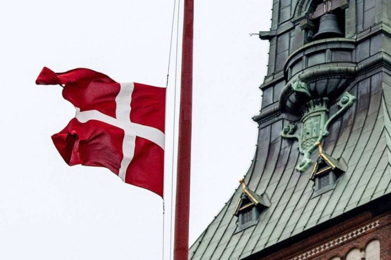 The Danish flag is seen at half mast at Copenhagen City Hall