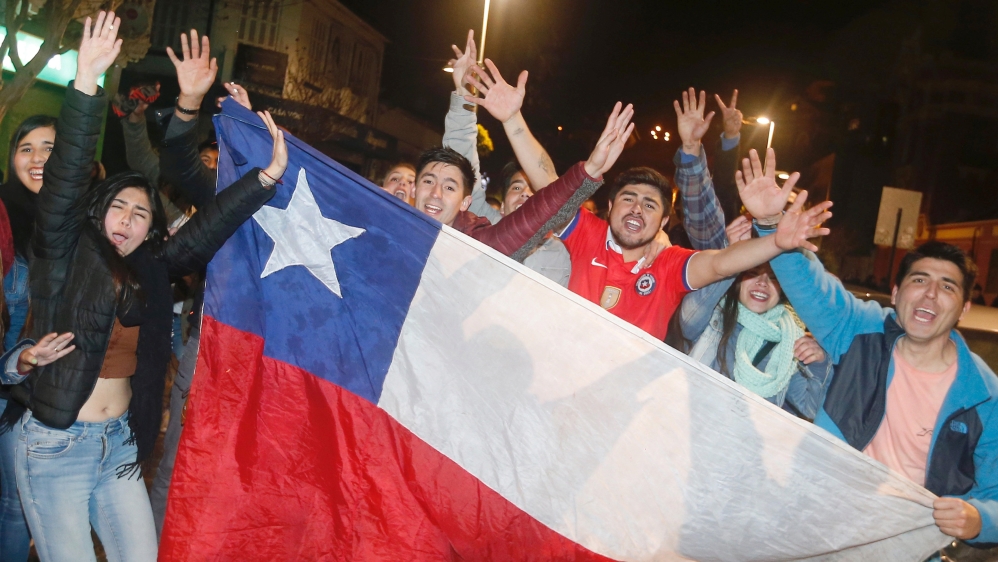 Chilean fans in Vina del Mar celebrate their team defeating Argentina in the Copa America final [Rodrigo Garrido/Reuters]