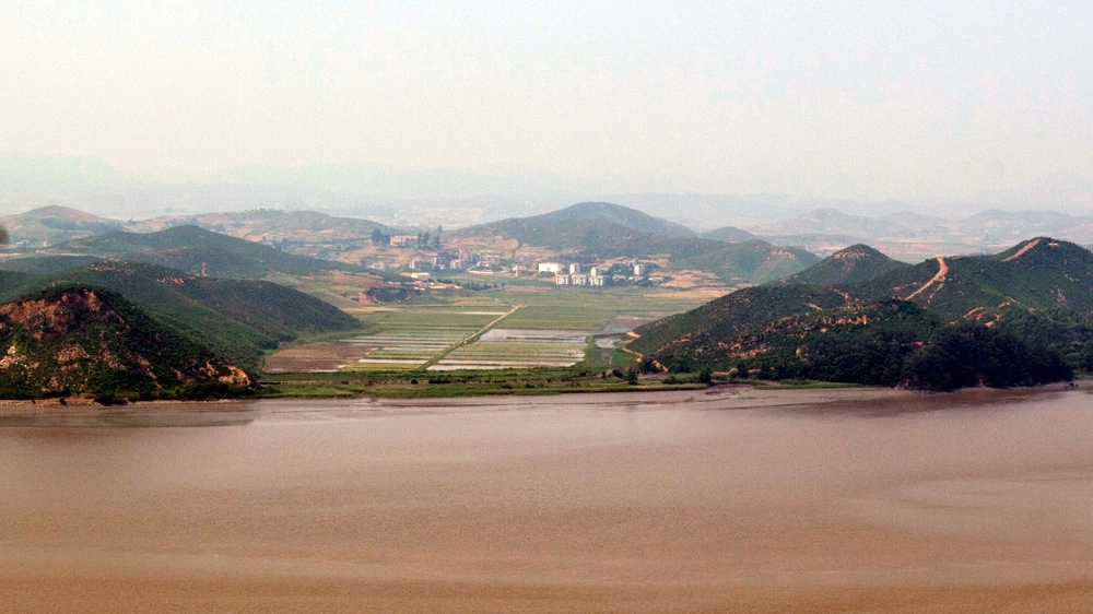 North Korea’s Kaepung county seen from South Korea’s 154m-high Aegibong Peak [Joel Lawrence/Al Jazeera]
