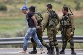 Israeli soldiers detain Palestinian near sinjil