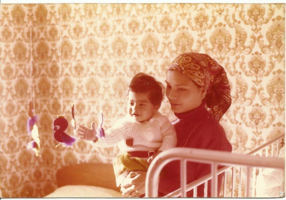 The author's mother with her first child in East Ham, London, 1977, a few months after moving to the UK for work [Courtesy of Sanam Maher]