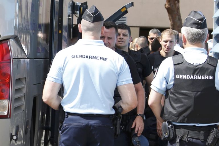 Repeating with additional information for clarification - Russian soccer fans are ushered off a bus by gendarmes in Mandelieu near Cannes in southern France
