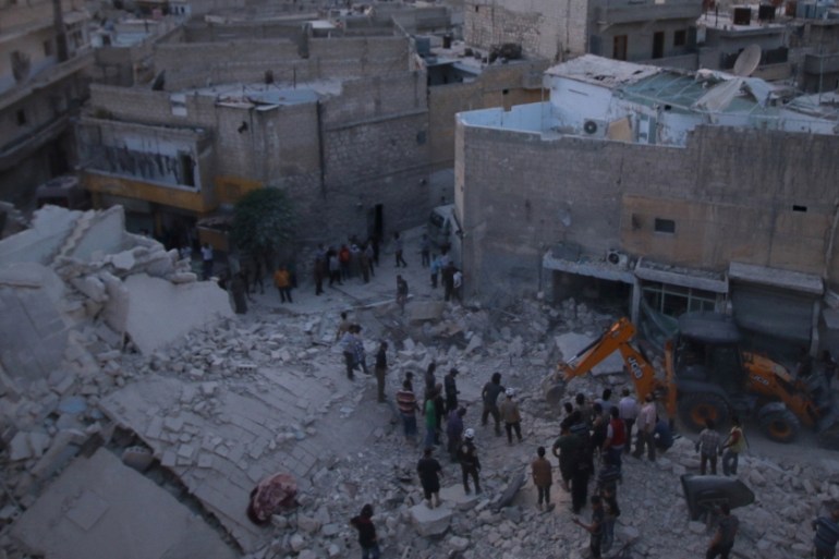 Men inspect damage after an airstrike on Aleppo''s rebel held al-Hallak neighbourhood