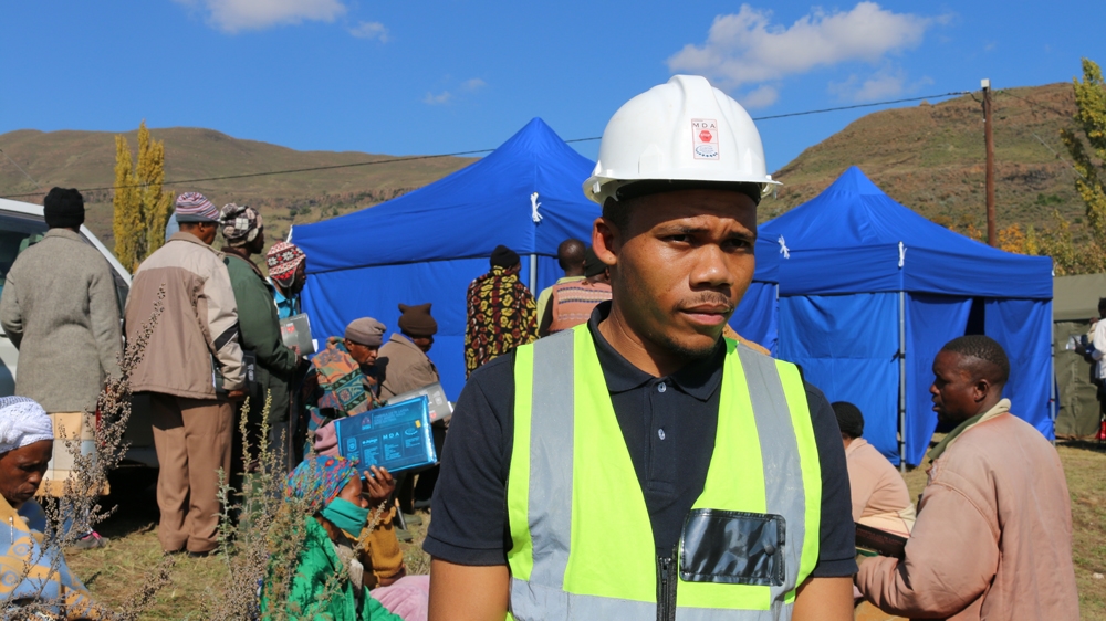 An accounting graduate, Tau Tau works supporting ex-miners to get access to healthcare and apply for compensation [Caelainn Hogan/Al Jazeera]