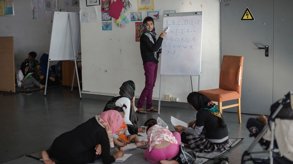 An Afghan girl provides English lessons to pass the time [Nick Paleologos/SOOC/Al Jazeera]