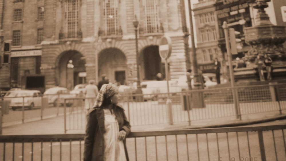 The author's mother in Piccadilly Circus, London, pregnant with her oldest daughter. This photograph was taken shortly after she arrived in the city from Karachi [Courtesy of Sanam Maher]