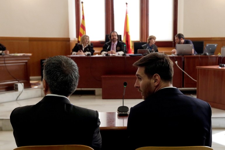 Barcelona''s Argentine soccer player Lionel Messi sits in court with his father Jorge Horacio Messi during their trial for tax fraud in Barcelona