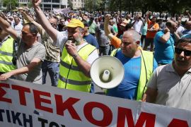 Port workers shout slogans during a demonstration against the privatisation of the ports of Piraeus and Thessaloniki, in Athens, Greece [EPA]