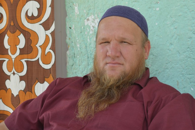 Ibrahim Delic sits outside of his house in the village of Gornja Bocinja