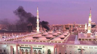 Prophet Mohammed Mosque with smoke rising in the background in the holy city of Medina, in Saudi Arabia [EPA]