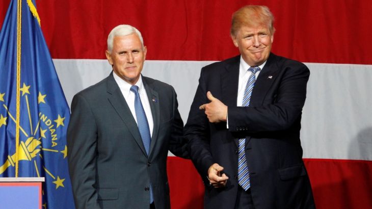 Republican presidential candidate Donald Trump and Indiana Governor Mike Pence wave to the crowd before addressing the crowd during a campaign stop at the Grand Park Events Center in Westfield