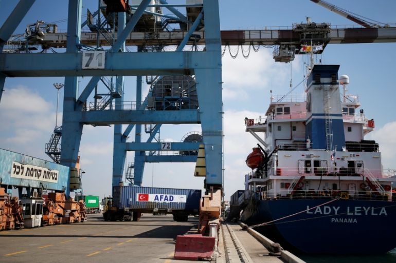 Containers are unloaded from the Panama-flagged Lady Leyla, a Turkish ship carrying humanitarian aid to Gaza, at the Ashdod port, in southern Israel
