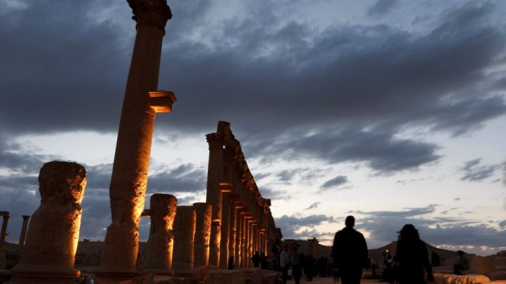 People visit the ruins of the historic city of Palmyra ahead of a musical event at its amphitheatre