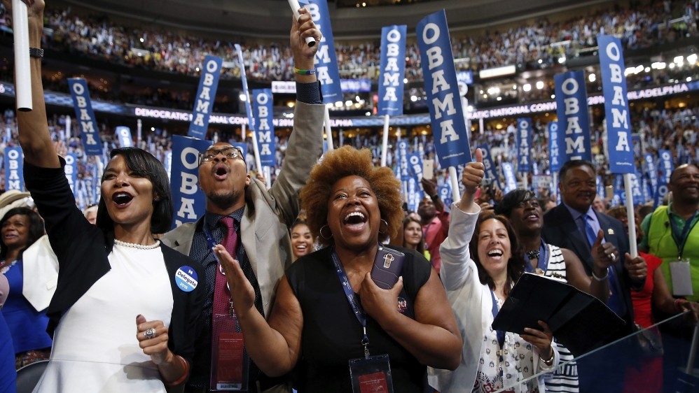 Delegates cheer as Obama addresses the Democratic National Convention [Justin Lane/EPA]