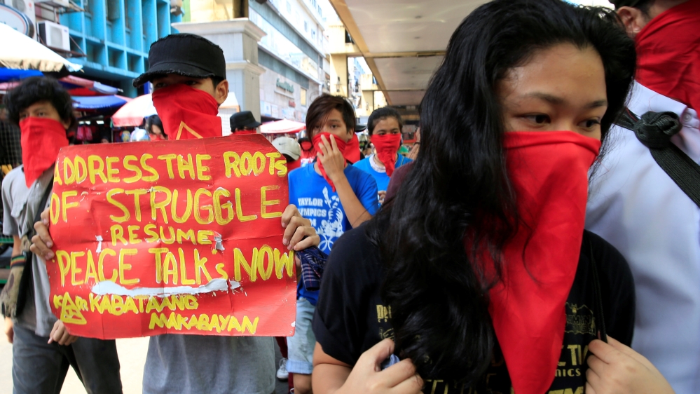 Supporters of the NDF march have called for the government to back peace talks with protests [File: Romeo Ranoco/Reuters]