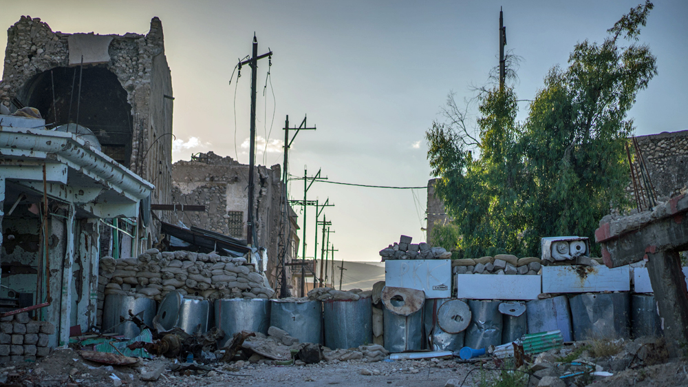 A badly damaged barricade and fighting position in Sinjar's old town [John Beck/Al Jazeera]