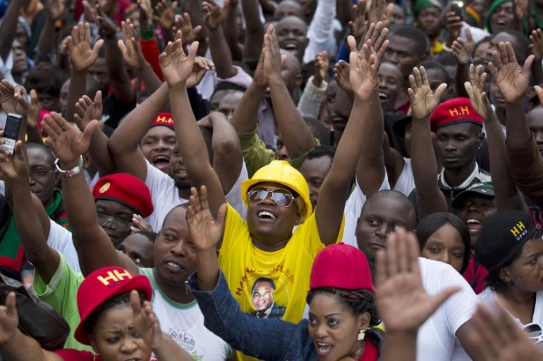 UPND supporters react as presidential candidate Hichilema arrives at a rally in Lusaka