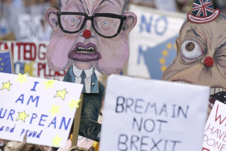 People hold banners, depicting Michael Gove and Nigel Farage, during a ''March for Europe'' demonstration against Britain''s decision to leave the European Union, in central London, Britain [REUTERS]