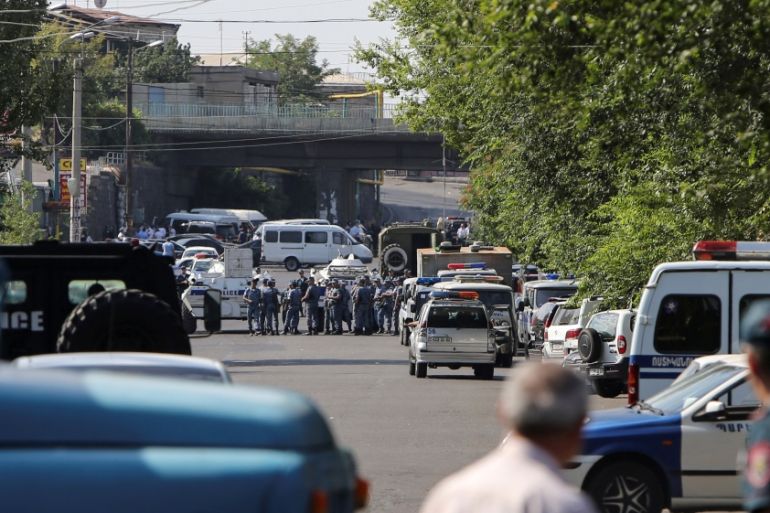 Policemen block a street after group of armed men seized a police station along with an unknown number of hostages, according the country''s security service, in Yerevan, Armenia