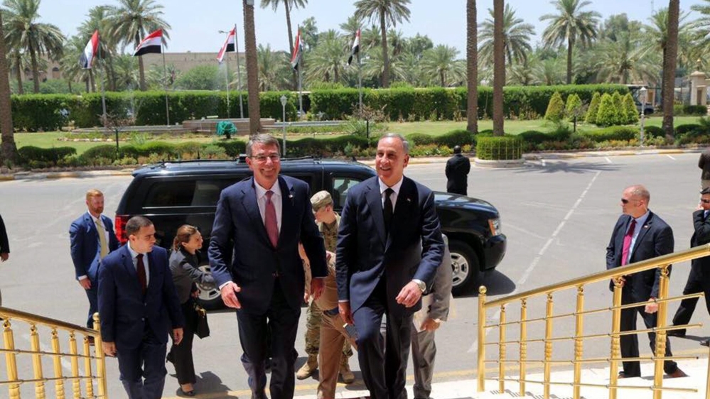 Ashton Carton, left, made the comments as he made an unannounced visit to the Iraqi capital [EPA]
