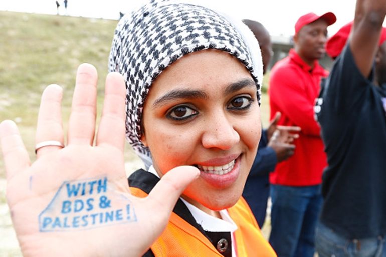 Pro-Palestinian protestor supporting the BDS campaign against Israel demonstrates in Cape Town, South Africa [Getty]