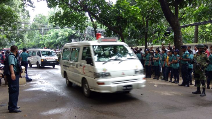 An ambulances drives on a road near the Holey Artisan restaurant after Islamist militants attacked the upscale cafe in Dhaka