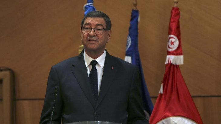 Tunisian PM Essid speaks during the opening of the National Conference on Employment in Tunis